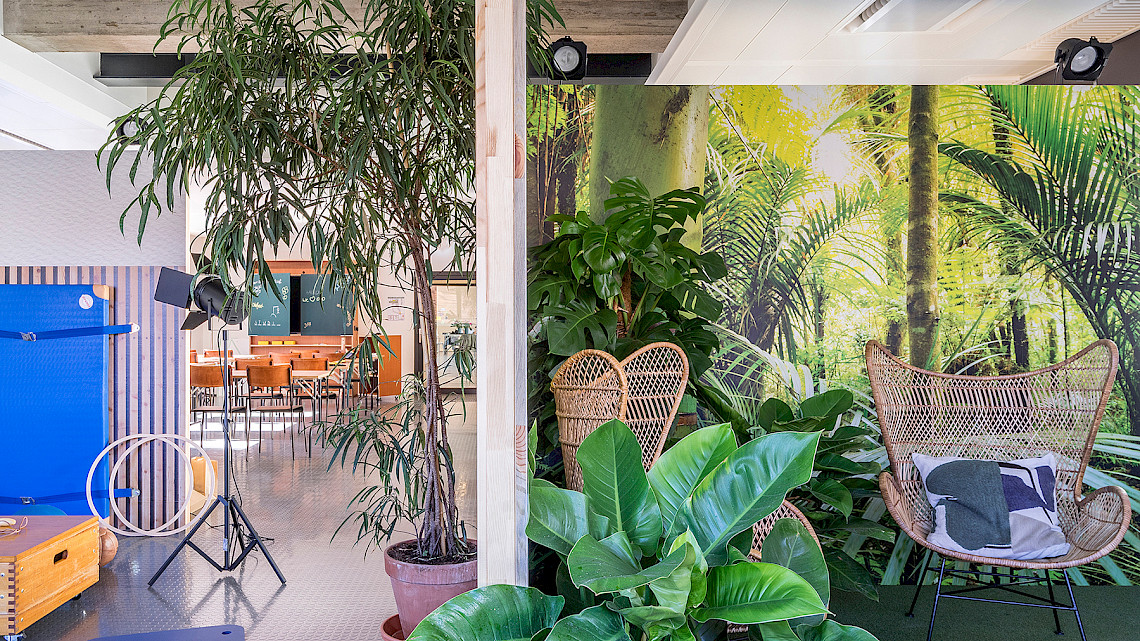 Creative working area in jungle design - OutOfOffice Stuttgart