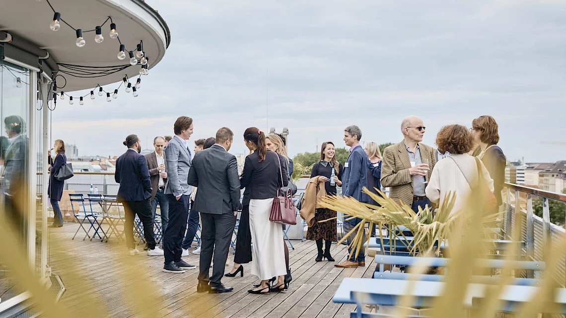 Networking on the roof terrace of our summer party location in Munich