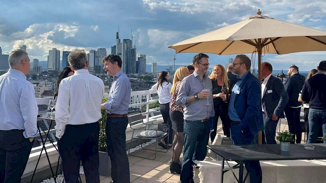 Networking at the summer party on the roof terrace in Frankfurt Sachsenhausen