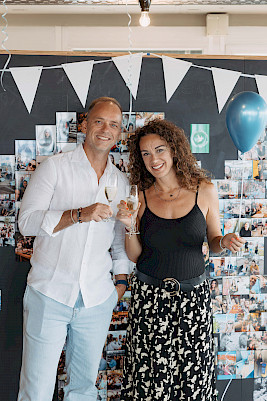 Champagne toast to 10 years of OutOfOffice: Our founders Georg Sauter & Chiara Oliva