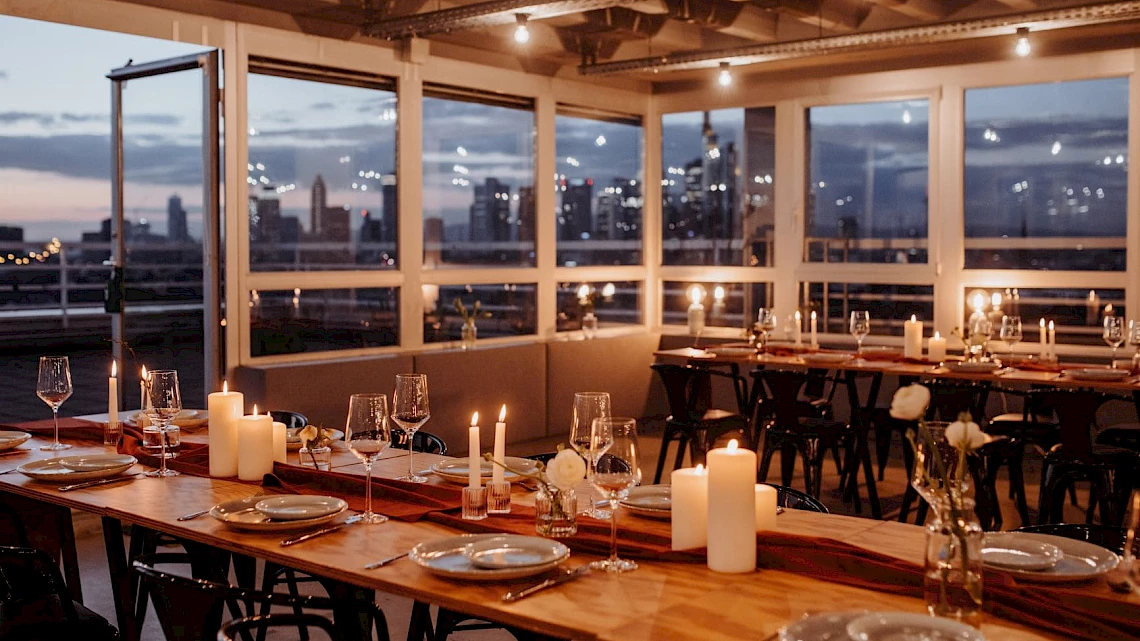 Christmas party in Frankfurt with a view of the illuminated skyline