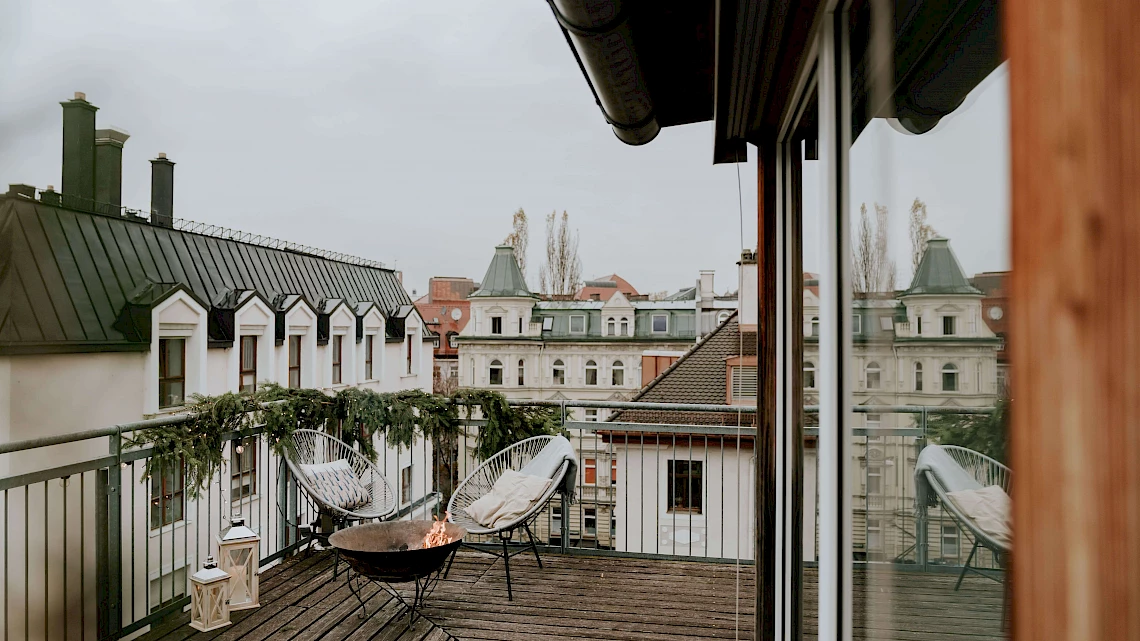 Fire bowl on the roof terrace of the location for your Christmas party in Munich