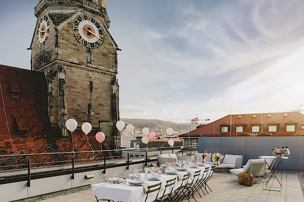 Birthday venue in Stuttgart with a rooftop terrace and a view of the Stiftskirche