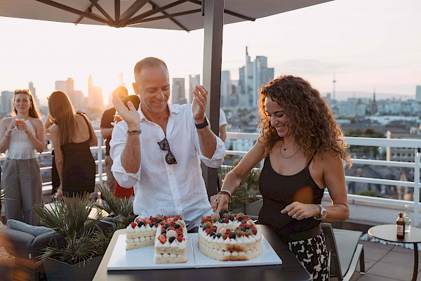 A slice of birthday cake with the Frankfurt skyline in the background