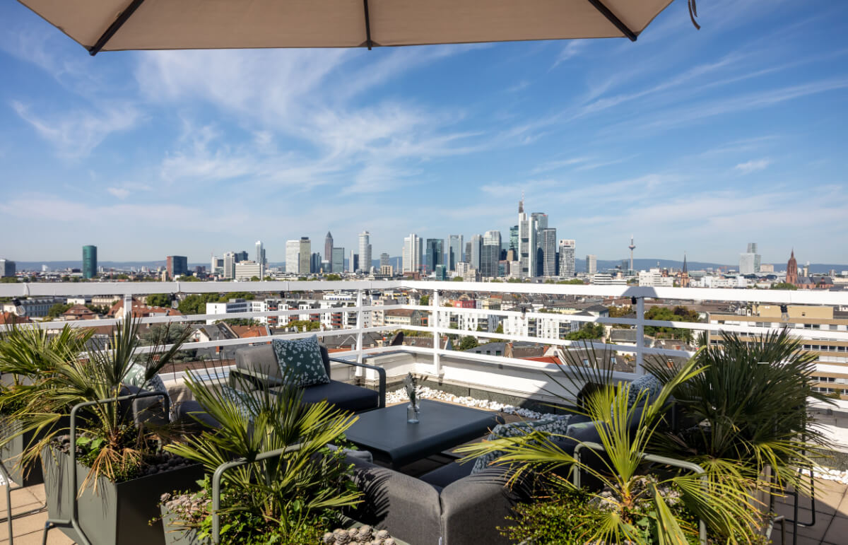 Rooftop afterwork event on a terrace overlooking the Frankfurt skyline
